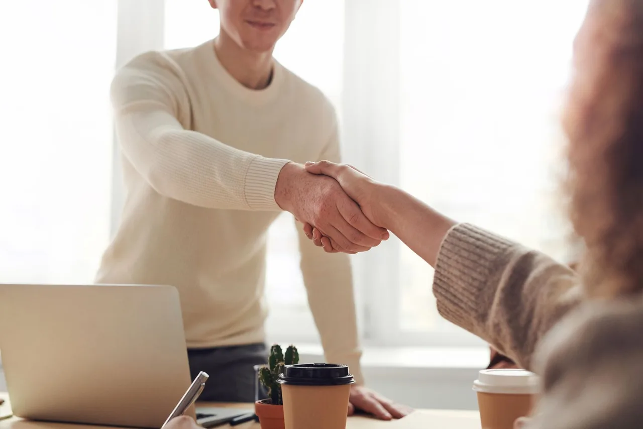 Handshake at a closing table