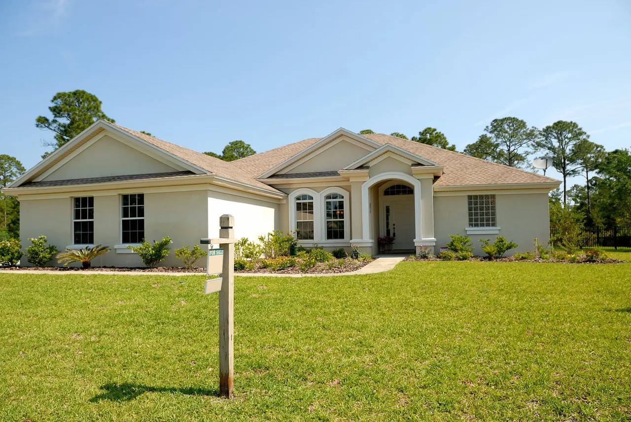 Ranch home with a yard sign post